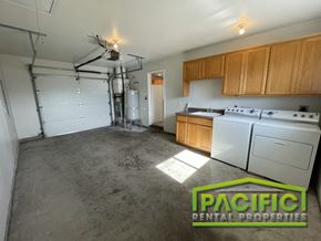 Medford apartment for rent - an empty kitchen with white appliances and wood cabinets