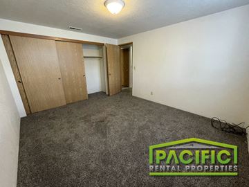 Medford apartment for rent - a living room with carpet and a door to a closet