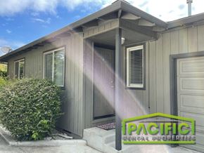 Medford apartment for rent - a remodeled home with a front porch and a logo for pragmatic residential properties