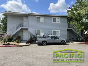 Medford apartment for rent - a blue house with a truck parked in front of it