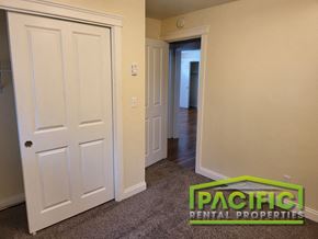 Ashland apartment for rent - a bedroom with a closet and a door to a hallway