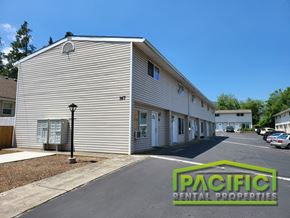 Ashland apartment for rent - a large white building with a street in front of it