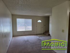 Ashland apartment for rent - the living room of an empty house with a window