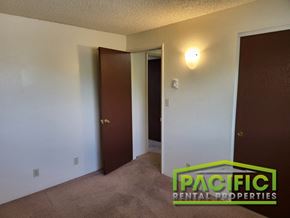Ashland apartment for rent - a bedroom with two doors and a closet and a door to the bathroom