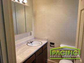 Ashland apartment for rent - a bathroom with a sink and a mirror and a toilet