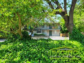 Ashland apartment for rent - a house with a street sign in front of a tree