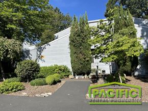 Ashland apartment for rent - the front of a white building with a sign that says pacific on the driveway