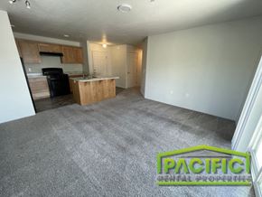 Medford apartment for rent - an empty living room with a kitchen in it