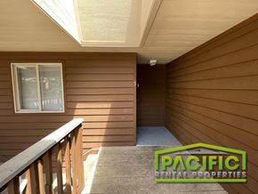 Medford apartment for rent - a home with a stairway leading up to a room with wood walls
