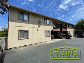 Medford apartment for rent - a commercial building with a parking lot in front of it