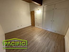Ashland apartment for rent - the living room of a house with white walls and wood floors