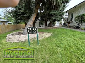 Ashland apartment for rent - a yard with a street sign in the grass