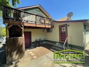 Ashland apartment for rent - the front of a house with a balcony and a bike