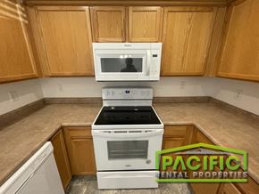 Medford apartment for rent - a kitchen with a stove and a microwave