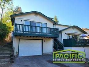 Ashland apartment for rent - a house with a garage door and a balcony