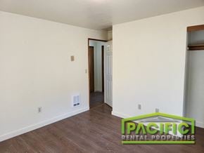 Ashland apartment for rent - a living room with white walls and a wooden floor