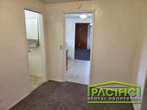 Ashland apartment for rent - a small hallway with a door to a bathroom and a hallway leading into a bedroom