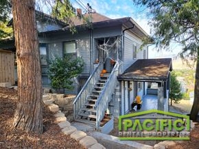 Ashland apartment for rent - the front of a house with a porch and stairs