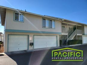 Medford apartment for rent - a building with two garage doors and a pacific rental properties sign