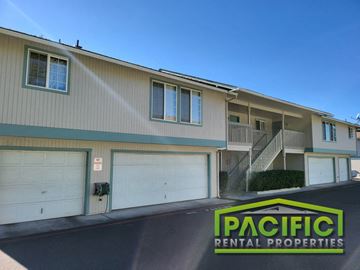 Medford apartment for rent - a building with two garage doors and a pacific rental properties sign