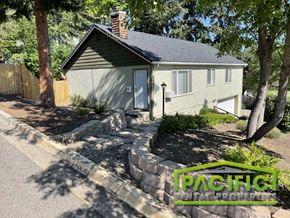 Ashland apartment for rent - a small house with a stone retaining wall