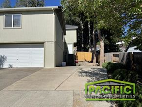 Ashland apartment for rent - a house with a driveway and a white garage door