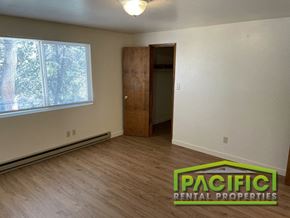 Ashland apartment for rent - an empty living room with wooden floors and a window