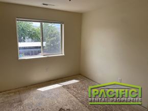 Medford apartment for rent - an empty room with a window and a tiled floor