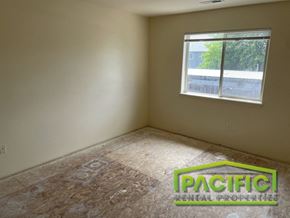 Medford apartment for rent - the interior of a room with a wooden floor and a window