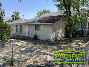 Ashland apartment for rent - a small white house with a chain link fence