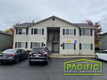Medford apartment for rent - an apartment building with cars parked in front of it