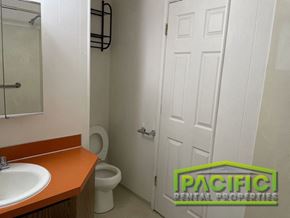 Ashland apartment for rent - A bathroom with a toilet, sink, and door.