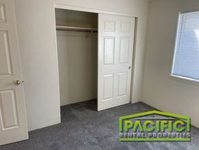 Medford apartment for rent - a bedroom with a closet and a carpeted floor