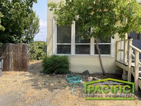 Ashland apartment for rent - a house with a garden hose in front of it