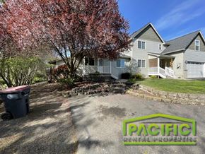 Medford apartment for rent - A tree with red leaves is in front of a house.