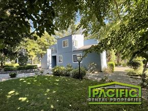 Ashland apartment for rent - A house with a sign that says Pacific Rental Properties in front of it.
