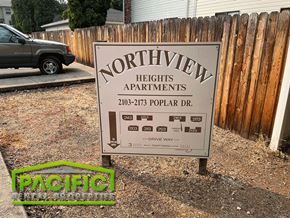 Medford apartment for rent - a sign for northern heights apartments in front of a wooden fence