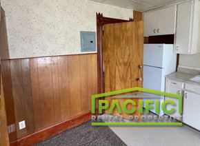 Ashland apartment for rent - a kitchen with wood paneling and a wooden door