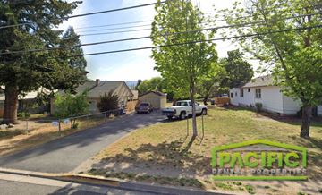 Ashland apartment for rent - a street with a white truck parked on the side of the road