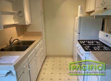 Ashland apartment for rent - a small kitchen with a stove and a sink