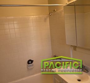 Ashland apartment for rent - a bathroom with a green sign on the sink