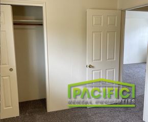 Ashland apartment for rent - a closet and an open door in a room
