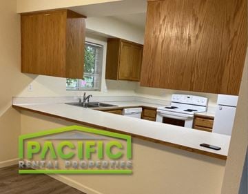 Medford apartment for rent - a kitchen with a white counter top and wooden cabinets