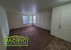 Phoenix apartment for rent - the living room of an empty house with a wooden floor