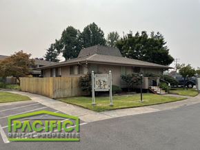 Medford apartment for rent - a house with a wooden fence and a sign in front of it