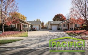 Medford apartment for rent - a street with two houses and a car parked in the driveway