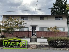 Medford apartment for rent - a white house with a red brick