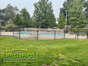 Medford apartment for rent - a tennis court with a fence around it and a swimming pool