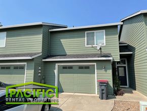 Central Point apartment for rent - a green house with a green garage door