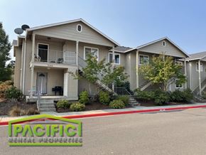 Medford apartment for rent - a home with a parking lot in front of it